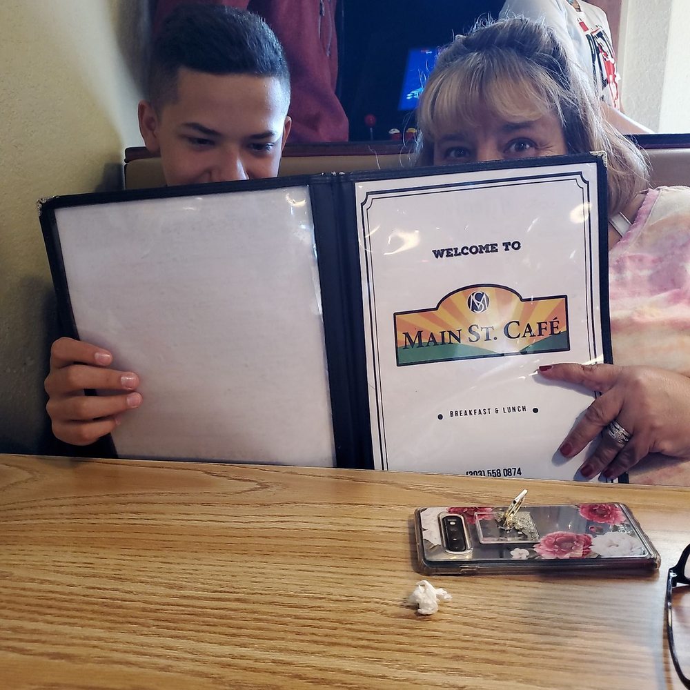Main Street Cafe - My wife and son exploring the menu - Breakfast & Brunch Near Me - Brighton, Colorado