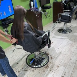 Buzzing Bee Kids and Family Hair Salon - Hair on floor from previous boy not swept up - a few snips for split ends - joke