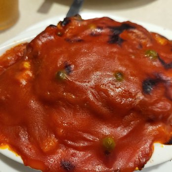 The Boss Restaurant - a pizza covered in sauce - Chinese Near Me - Burnaby, British Columbia