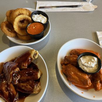 Wings and Rings - Onion rings, Medium sauce wings and Blueberry BBQ wings. Phenomenal! - Chicken Wings Near Me - Lewis Center, Ohio