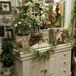 Rustic & Refined Interiors - This is an old dry sink that can be used as a potting bench,below a TV, a coffee bar...etc! Don't you just love all of the garden decor?