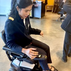 Elmora Healthcare - Emma from Celebrity Silhouette Guest Services driving the wheel chair to our guest cabin. She loved it!  I carried the bed rail.
