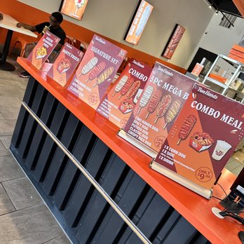 Two Hands Fresh Corn Dogs - a row of menus at a fast food restaurant - Hot Dogs Near Me - Sugar Land, Texas Two Hands Fresh Corn Dogs - a row of menus at a fast food restaurant - Hot Dogs Near Me - Sugar Land, Texas