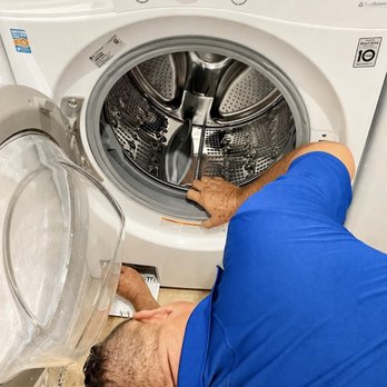 ApplianceCheck - Washer repair technician fixing washing machine not draining. - Appliances & Repair Near Me ApplianceCheck - Washer repair technician fixing washing machine not draining. - Appliances & Repair Near Me