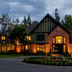 Northwest Outdoor Lighting - Beautiful entrance lit by landscape lighting designed and installed by Northwest Outdoor Lighting.