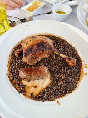 Photo of La Provence - Ambler, PA, US. Duck leg, lentils, I think homemade duck sausage. Very yummy sausage. Duck skin is just crispy, not fatty, meat is very tender and juicy.