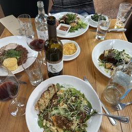 Entrees from bottom center clockwise, Beef & pork bolognese, pork duo with cornbread muffin, fried chicken and bison spare rib