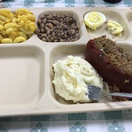 a plate of meatloaf, mashed potatoes, and beans a plate of meatloaf, mashed potatoes, and beans