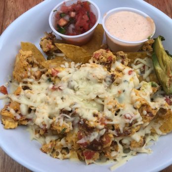 Ruby Slipper Pensacola - A speciality, "Migas" (12.00) tex-mex egg scramble with chorizo, pico de gallo, avocado, pepper jack cheese, over crunchy tortilla chips. - Breakfast & Brunch Near Me - Pensacola, Florida Ruby Slipper Pensacola - A speciality, "Migas" (12.00) tex-mex egg scramble with chorizo, pico de gallo, avocado, pepper jack cheese, over crunchy tortilla chips. - Breakfast & Brunch Near Me - Pensacola, Florida