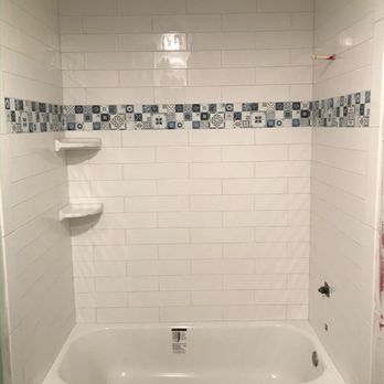 CB Stone & Tile - a bathtub and shower - Flooring Near Me