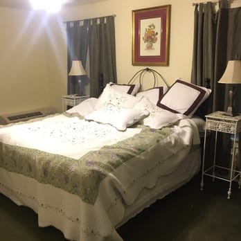Full Moon Inn - Grape Suite bedroom with King sized bed (don't judge, I sloppily made the bed that morning). - Bed & Breakfast Near Me - Fredericksburg, Texas Full Moon Inn - Grape Suite bedroom with King sized bed (don't judge, I sloppily made the bed that morning). - Bed & Breakfast Near Me - Fredericksburg, Texas