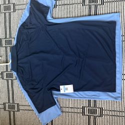 Light blue is the old shirt, dark blue is the new shirt. Company had all of my information from when I purchased the light blue shirt.