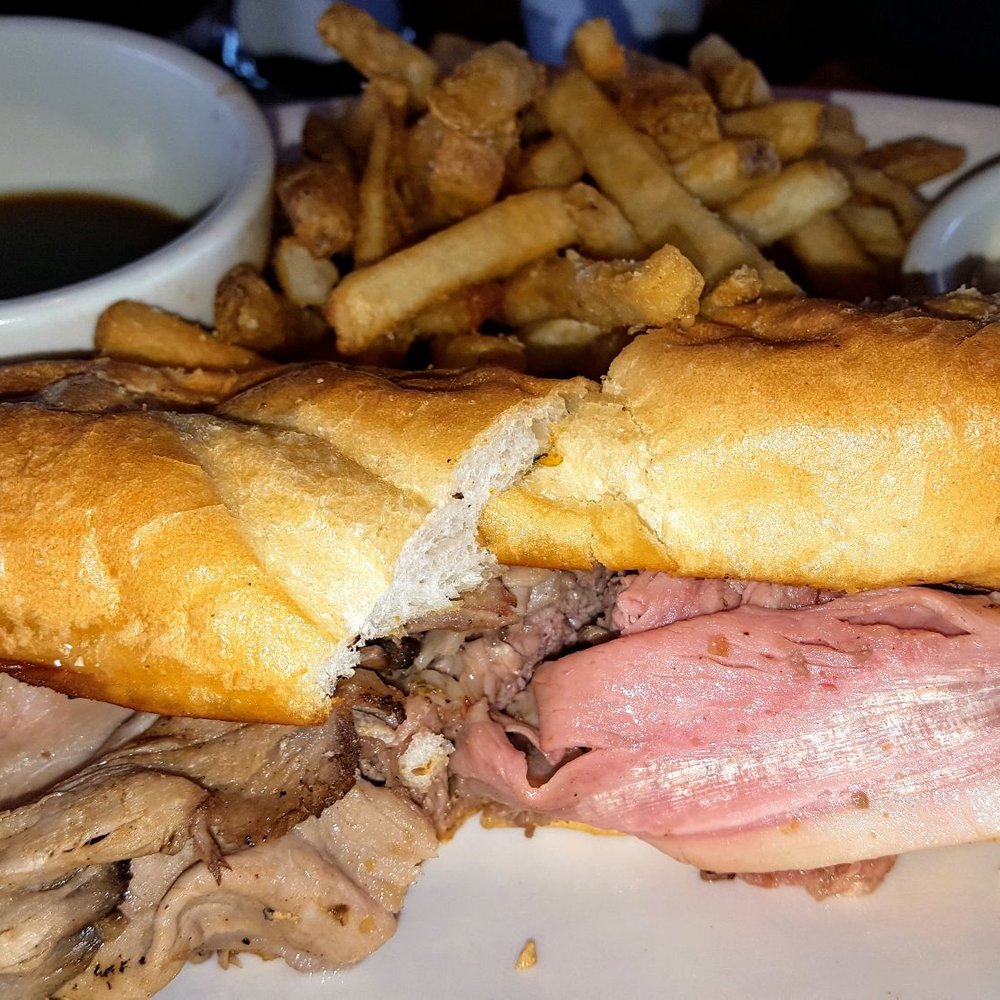 BJ's Restaurant & Brewhouse - Prime Rib dip sandwich. Very tender! Comes with fries, au jus, and horseradish sauce. - New American Near Me - Boardman, Ohio