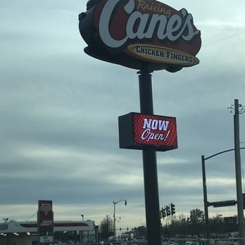 Raising Cane's Chicken Fingers - a large sign for a fast food restaurant - Chicken Shop Near Me - Springfield, Missouri