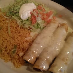 El Toreo - Golden Enchiladas: fried chicken enchiladas covered in cheese sauce with guacamole salad and rice
