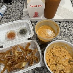 Spicy curry chicken panang and crab Rangoon with a Thai iced tea