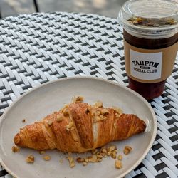 Tarpon Social Club - Croissant + honey and walnuts & cold brew on their adorable patio