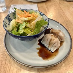 Side salad and two shrimp dumplings Side salad and two shrimp dumplings