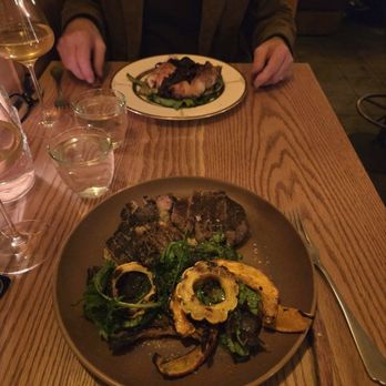 Betsy - Heritage pork chop with winter greens (kale) and squashes. Wood oven half chicken with agrodolce onions on a bed of braised chicory. - Steakhouses Near Me - Altadena, California