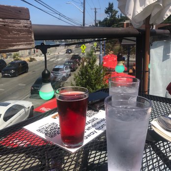 Christo's On Alki - Cold Incline Marionberry Cider sitting at their balcony - Greek Near Me - Seattle, Washington