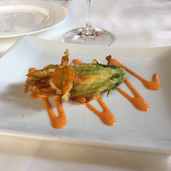Osteria I Nonni - Burrata stuffed squash blossom with roasted red bell pepper drizzle. - Italian Near Me - Mendota Heights, Minnesota Osteria I Nonni - Burrata stuffed squash blossom with roasted red bell pepper drizzle. - Italian Near Me - Mendota Heights, Minnesota
