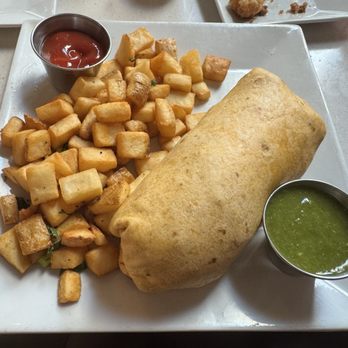 Hula's Modern Tiki - High Street - BREAKFAST BURRITO scrambled eggs, fried spam, jack cheese, potato, onion, red peppers, black beans, housemade salsa verde - Hawaiian Near Me - Phoenix, Arizona Hula's Modern Tiki - High Street - BREAKFAST BURRITO scrambled eggs, fried spam, jack cheese, potato, onion, red peppers, black beans, housemade salsa verde - Hawaiian Near Me - Phoenix, Arizona