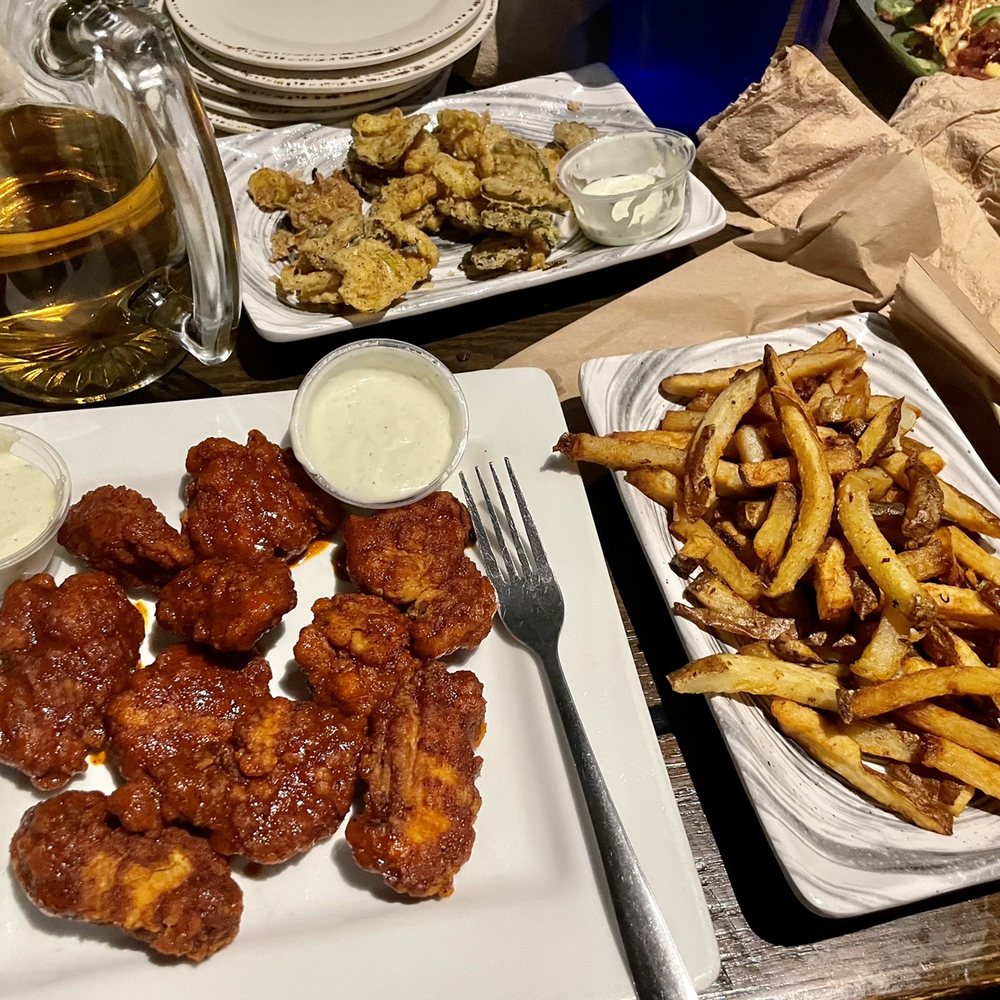 Nashville Hot boneless wings, Fries, and fried banana peppers/pickles
