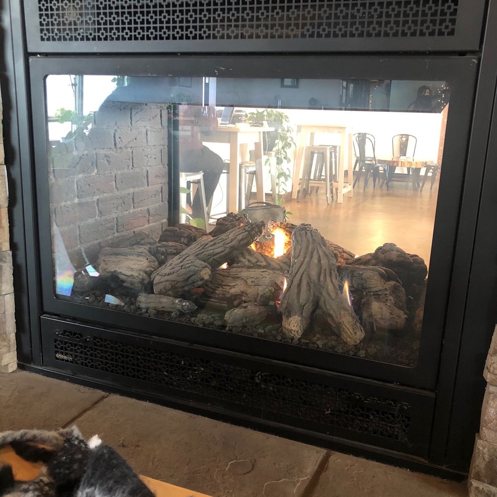 Fireplace that splits the two rooms. Fireplace that splits the two rooms.