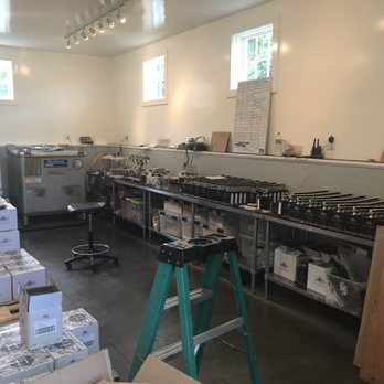 Hillrock Estate Distillery - Bottling is a Manual Operation, II of II. Notice cases are 1/2 the size of normal 9 liter cases - Distilleries Near Me - Ancram, New York