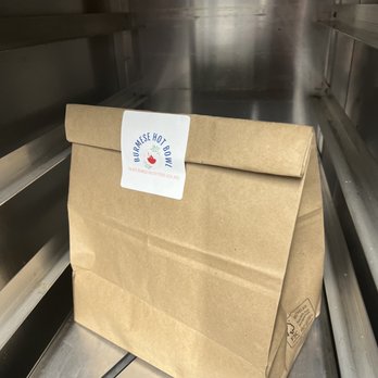 Merry Franksters - a brown paper bag on a conveyor belt - Food Trucks Near Me - Carrboro, North Carolina Merry Franksters - a brown paper bag on a conveyor belt - Food Trucks Near Me - Carrboro, North Carolina