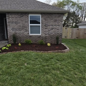 Cox Irrigation and Landscaping - Newly added landscape bed, retaining wall, and new plants with a touch of mulch. - Irrigation Near Me - Joplin, Missouri Cox Irrigation and Landscaping - Newly added landscape bed, retaining wall, and new plants with a touch of mulch. - Irrigation Near Me - Joplin, Missouri