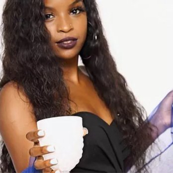 Coco Bunny Entertainment - a woman holding a cup of coffee - Bartenders Near Me