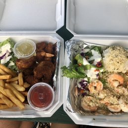 Coconut shrimp w/ fries and garlic shrimp w/ rice. Yum.