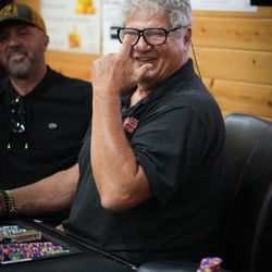 Outlaws Card Parlor - A happy man playing poker at Outlaws Card Parlor in the Central Coast.