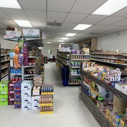 Reem Market - Wide variety of drinks, sweets, and fresh bread.