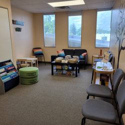 Stewart SLP - Welcoming waiting room with books and toys.