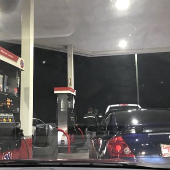 Circle K - a man filling up his car at a gas station - Convenience Stores Near Me - SAN BERNARDINO, California
