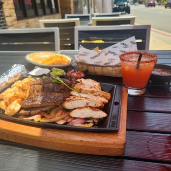 Kalaveras - Fajitas with asada chicken and shrimps with a Chamoyda Margarita - Cocktail Bars Near Me - Bellflower, California Kalaveras - Fajitas with asada chicken and shrimps with a Chamoyda Margarita - Cocktail Bars Near Me - Bellflower, California