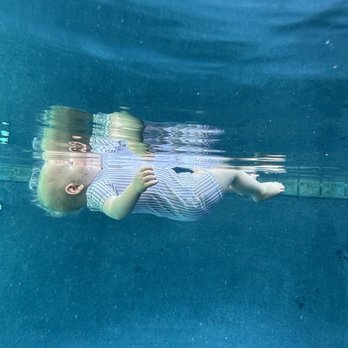 Swim Synergy - Baby in survival float, resting & breathing at the surface. - Swimming Lessons/Schools Near Me Swim Synergy - Baby in survival float, resting & breathing at the surface. - Swimming Lessons/Schools Near Me