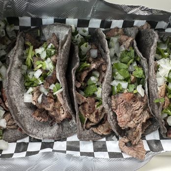 Taco Capital - Asada pack at Taco Capital with flame grilled ribeye and blue corn tortillas loaded with onions and cilantro. - Tacos Near Me - San Antonio, Texas Taco Capital - Asada pack at Taco Capital with flame grilled ribeye and blue corn tortillas loaded with onions and cilantro. - Tacos Near Me - San Antonio, Texas