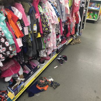 Dollar General - Cloths just thrown on base shelving. Clothes not hung properly. Cloths just thrown in a bin above cloths on hangers. - Discount Store Near Me - Alburgh, Vermont