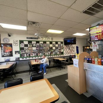Fred's Downtown Philly - Basic interior. Interesting photos on the walls - New American Near Me - Plano, Texas
