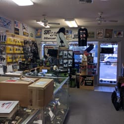 Arm's for Defense - Well stocked accessories section to include safety gear and small safes.