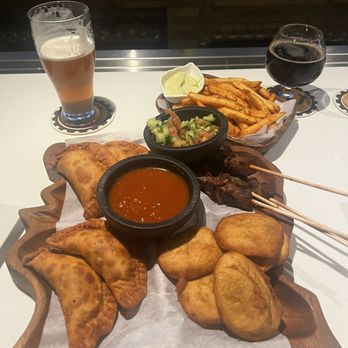 Les delices de Awa - Beef and Chicken Pastels, Sosso Frufru, beef skewers and frites. - African Near Me - Madison, Wisconsin Les delices de Awa - Beef and Chicken Pastels, Sosso Frufru, beef skewers and frites. - African Near Me - Madison, Wisconsin