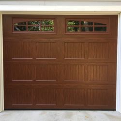 Ron Dulmaine & Sons Garage Doors - Haas steel carriage house overhead garage door with a bi-directional woodgrain finish