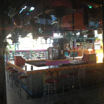Fudpucker's - View from my seat inside. Outside bar looks nice! Cool floor put there. - Seafood Near Me - Destin, Florida Fudpucker's - View from my seat inside. Outside bar looks nice! Cool floor put there. - Seafood Near Me - Destin, Florida