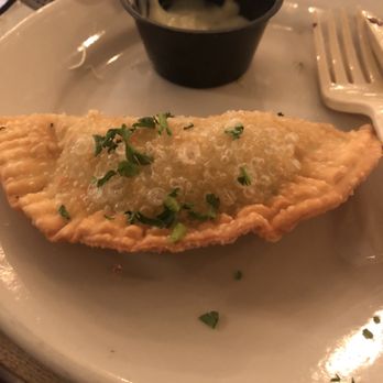 Pirilo - Delicious half eaten empanada - Italian Near Me - San Juan, Puerto Rico