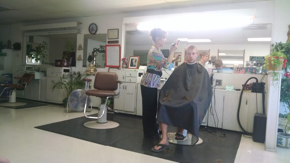 Simon's Quality Hair Grooming Logo