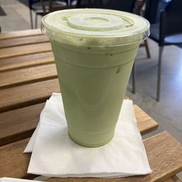 large cold matcha latte with oat milk