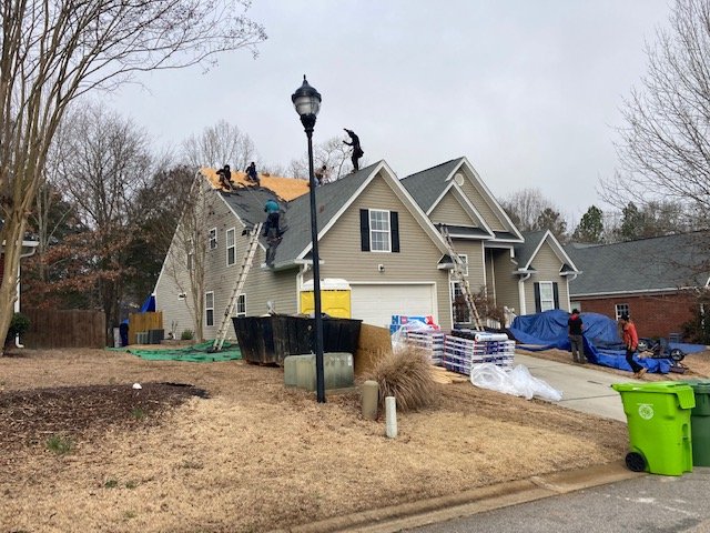 Slide of Gutter Guys Construction